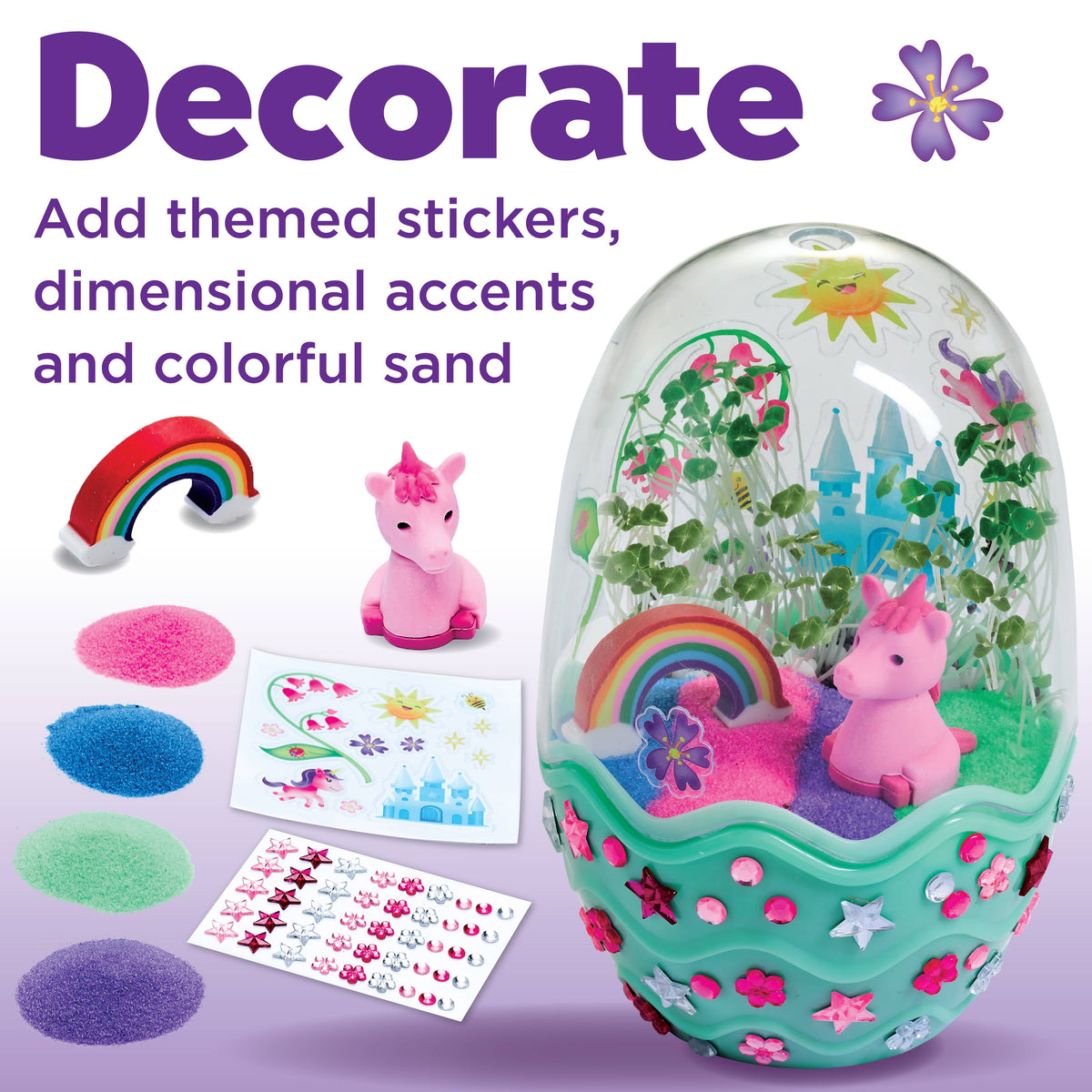 Decorative toy egg with unicorn, sand, and stickers on a white background