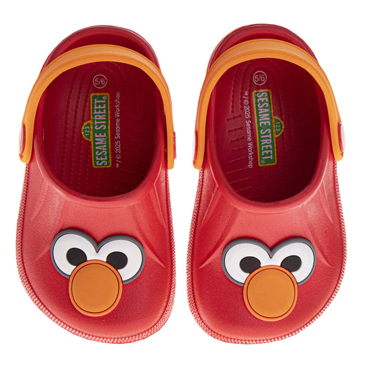 Red children's shoes with a cartoon face design on a white background