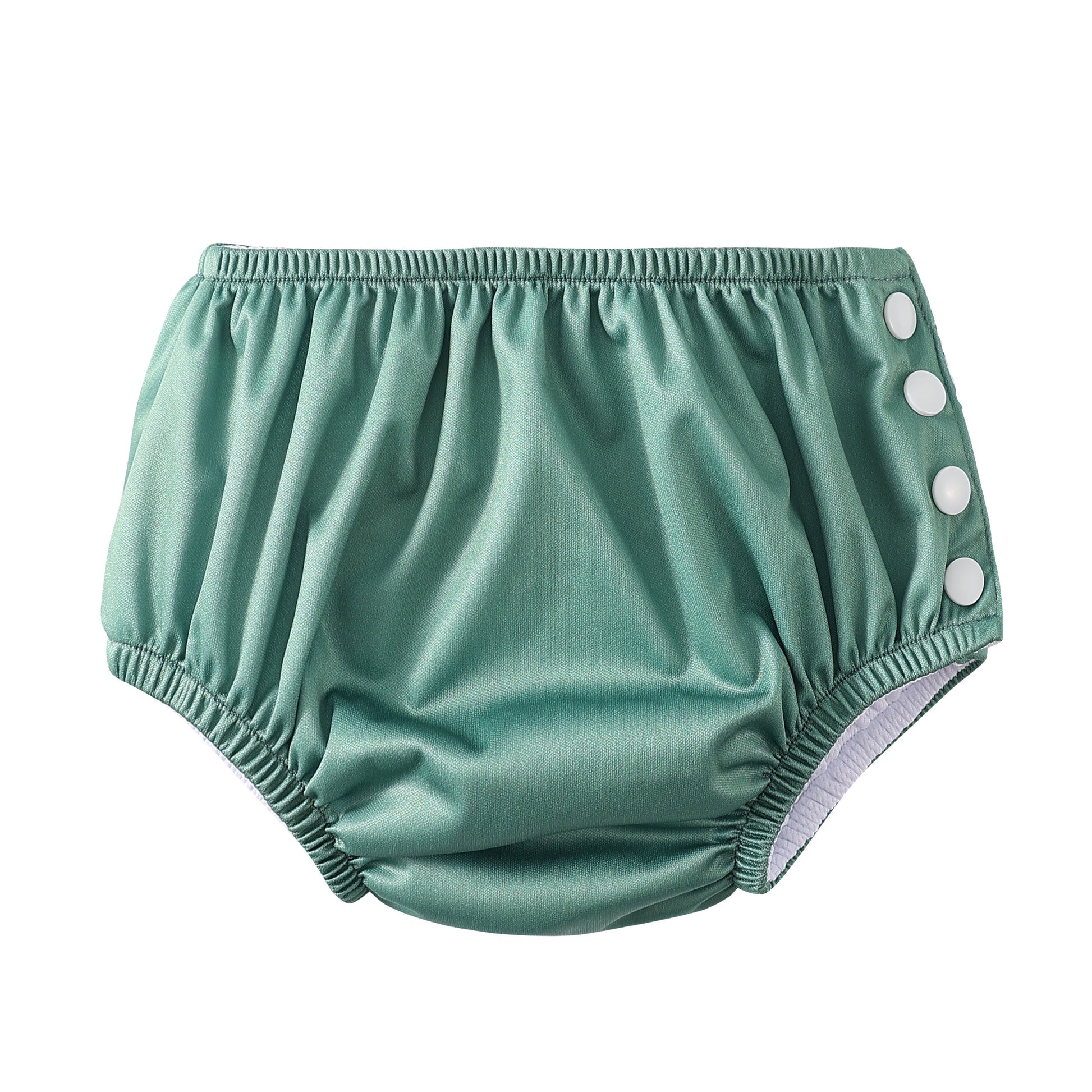 Green baby bloomers with button details on a white background