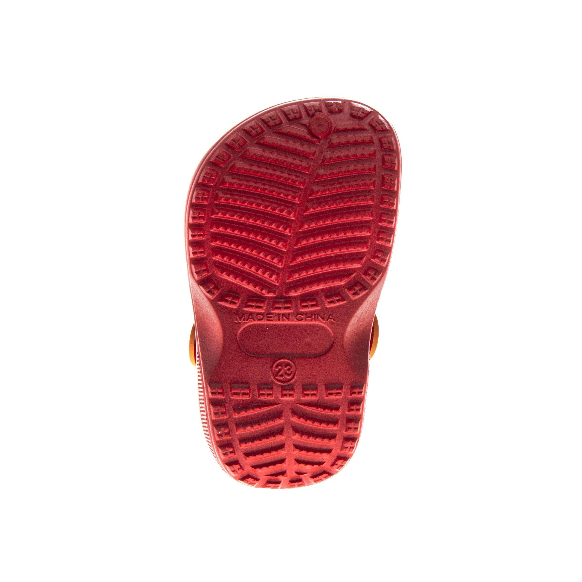 Red sole of a shoe with tread pattern on a white background